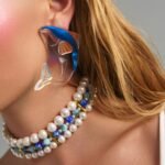 Moonwave Whale Earrings statement plexiglass whale earrings worn on model