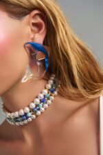 Moonwave Whale Earrings statement plexiglass whale earrings worn on model