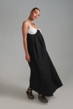 Black and white maxi dress with flowing silhouette and contrast bodice