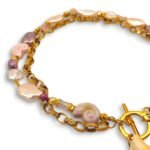 Shell necklace with pearls, ceramic beads and gold-plated chains