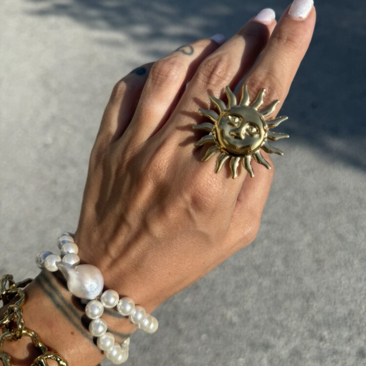 Helios stainless steel sun ring in gold.