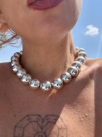 Titan Silver necklace with glossy silver acrylic beads.