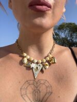 Belladonna charm necklace with ceramic floral beads.
